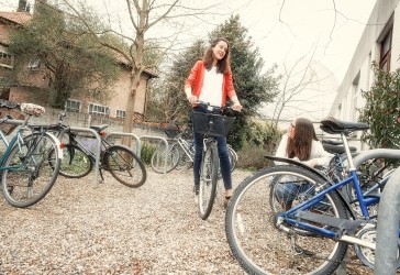 Photo of students outside the bike racks at Murray Edwards College