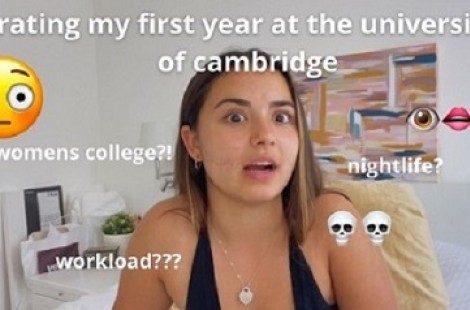 A thumbnail image of one of Malini's YouTube videos; she looks into the camera a little overwhelmed, with text on the screen that says 'Rating my First Year at the University of Cambridge'
